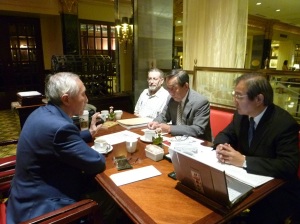 Yasutera Yamada (center), presenting his case to US officials.